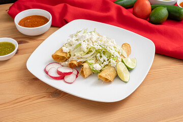 Spicy chicken flautas made with marinated meat and rolled corn tortillas. Traditional, delicious, and cheap Mexican food.