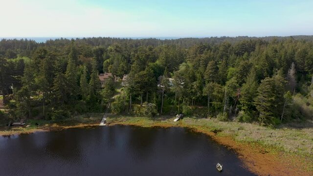 Wonderful View Of Bradley Lake With Green Pine Trees in Bandon, Oregon - Beautiful Tourist Destination - Aerial Shot