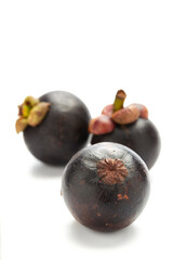 ripe mangosteen fruit on white background