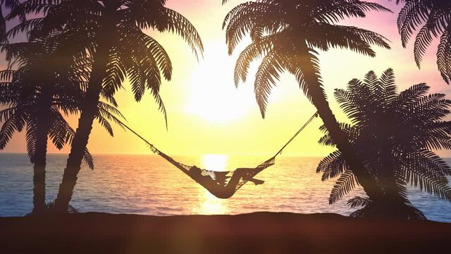 Female silhouette in a hammock on a background of dawn.