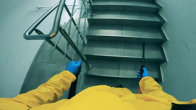 Disinfector sprays staircase to kill coronavirus.