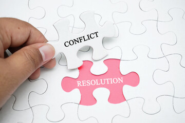 Missing puzzle with a word CONFLICT RESOLUTION. Business concept puzzle piece. Business and finance...