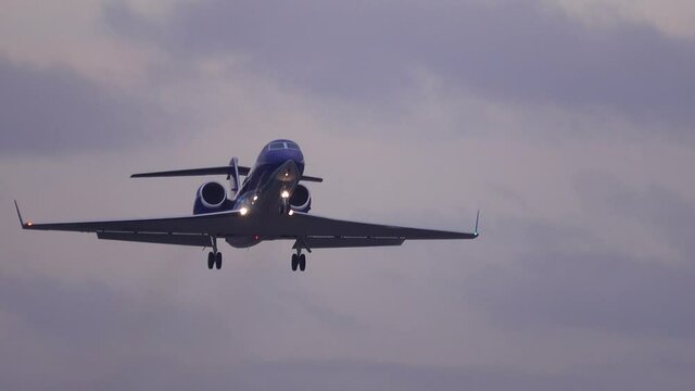 Business jet (private jet) taking off at dusk