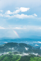 Beautiful rainbow on the mountain after summer rain