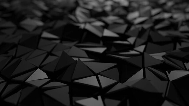 Seamless looping polygon background video. Triangle facets waveform. Mutated dark grey surface animation. Shallow depth of field Bokeh blur.