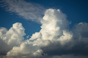 Beautiful white cotton-like clouds. White cloud cumulus. Water in the form of steam in the sky