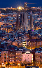 Naklejka premium Aerial distant view of Barcelona city at twilight. Barcelona, Spain.