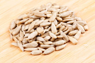 A close up  of sunflower kernels isolated on a wooden background