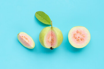 Fresh ripe guava with leaf on blue background.