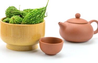 Fresh bitter gourd and cup.