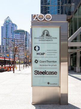 Toronto, Canada - May 16, 2020: Ground sign outside of the entrance to the offcie  of Templeton, MCAP, Grant Thorton and Steelcase with street view in background in downtown Toronto. 
