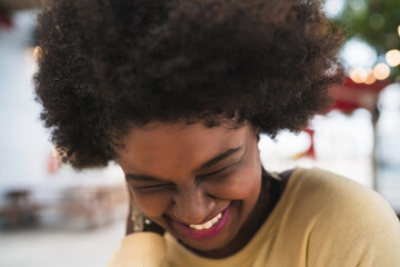 Afro american latin woman smiling.