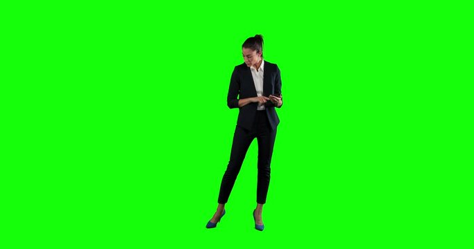 Animation of a Caucasian woman in suit walking and using a phone in a green background