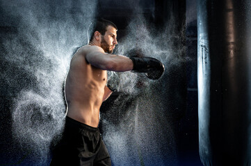 Close up Male boxer boxing in punching bag, slow motion 