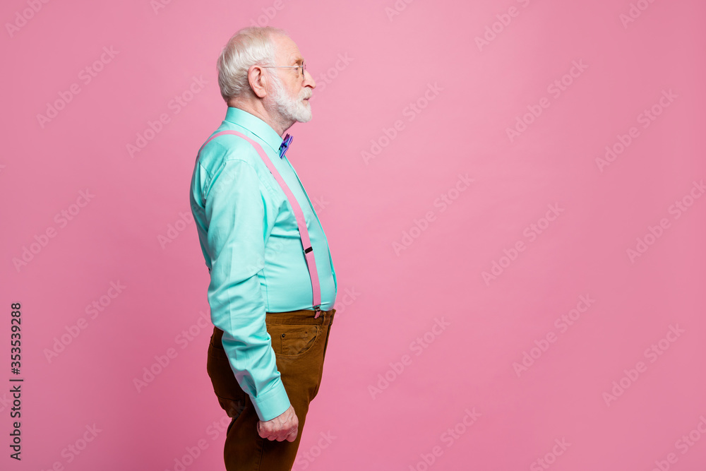 Sticker Profile photo of attractive grandpa looking empty space concentrated focused not smiling wear specs mint shirt suspenders bow tie pants isolated pink pastel color background