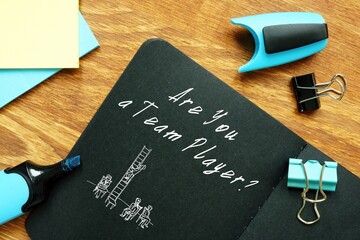 Business concept meaning Are You A Team Player with phrase on the sheet.