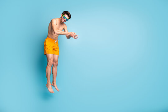 Full Length Body Size View Of His He Nice Attractive Cheerful Sportive Guy In Swimming Shorts Jumping Pretending Diving Isolated On Bright Vivid Shine Vibrant Green Blue Turquoise Color Background