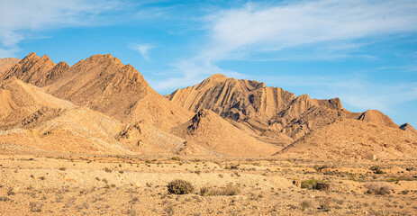 Tunisian desert with mountains and yellow sand