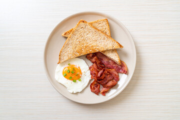 fried egg with bread toasted and bacon