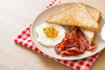 fried egg with bread toasted and bacon