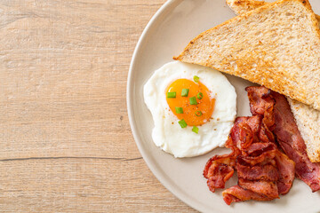 fried egg with bread toasted and bacon