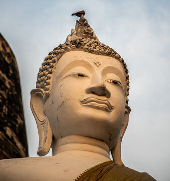  single Buddha statue inside Wat Yai Chai Mongkhon, a Buddhist temple of archaeological park, Ayutthaya, Thailand