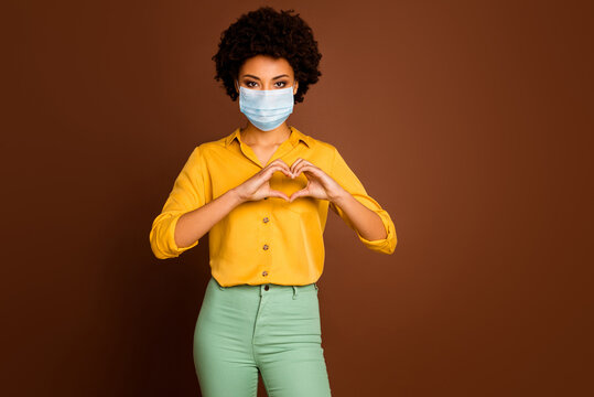 Portrait Of Her She Attractive Dark Skin Wavy-haired Lady Wearing Gauze Mask Showing Healthy Heart Symbol Health Care Healthcare Cardiac Cardiology Medicine Isolated Brown Color Background