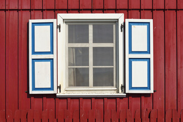 Wooden rustic window in small cottage house