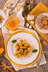 Pumpkin gnocchi with grated amaretti cookies.
