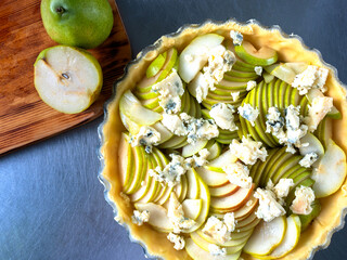 pie with pears and blue cheese. raw pears. cake before baking. cake making process.