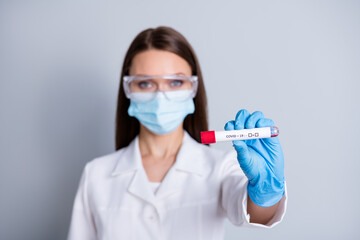 Closeup photo of lady professional doc clinic hospital virology examination hold arm analysis blood probe covid test results positive negative wear face mask isolated grey color background