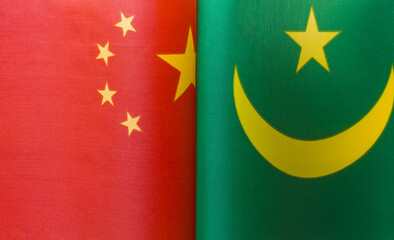 fragments of the national flags of China and Mauritania close up