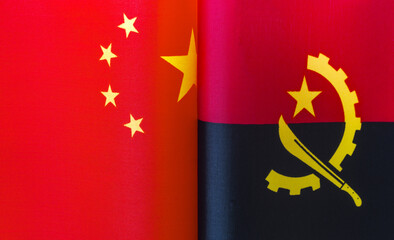 fragments of the national flags of China and the Republic of Angola close up