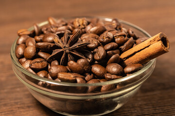 coffee beans with christmas spices in a glass bowl