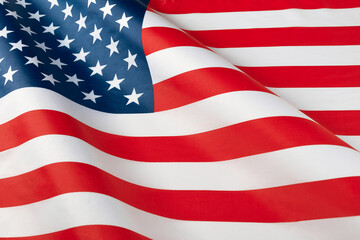 Close up of ruffled American flag. Satin texture curved flag of USA. Memorial Day or 4th of July....