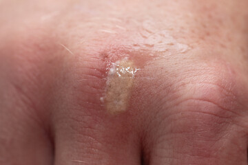 worn leather on a man’s hand