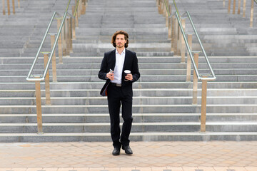 Portrait of an handsome businessman in the city.