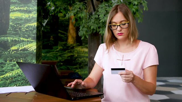 Female shopping online on green background. Online shopping service concept