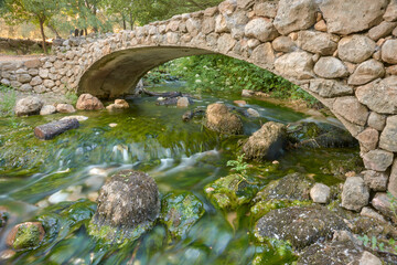 stone bridge over the source of the Cerzo river in Villanueva del Rosario, Málaga. Spain