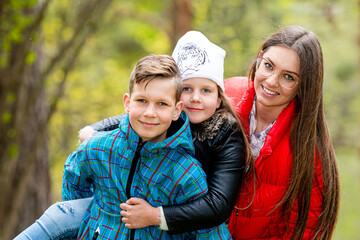 happy family walks through the woods and enjoys a warm spring day