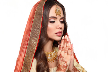 Mehendi. Portrait of beautiful indian girl in traditional saree isolated on white. Young hindu woman model with kundan golden jewelry set. Indian costume lehenga choli. Henna painting hands.