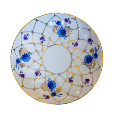 Isolated porcelain tea saucer. View from above. Flowers and a golden net. Hand painted. White background .  Imperial Porcelain Factory.