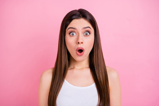Closeup photo of attractive shocked lady long perfect hairdo look speechless open mouth listen bad news wear casual white singlet isolated pastel pink color background
