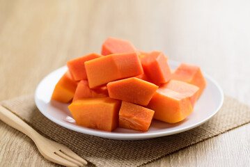 Sliced ripe papaya fruit on plate ready to eating, Tropical fruit