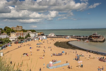 Golden sand of Viking Bay Broadstairs, Thanet, Kent, UK and the historic Bleak House on a sunny...