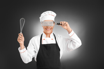 Naklejka premium Transgender chef on dark background