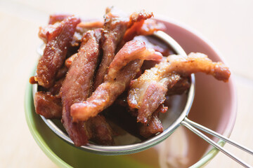 Deep fried pork put on sieve to drain the oil, homemade food