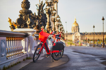 Bicycle for rent on Alexandre III bridge and Invalides cathedral
