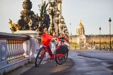 Papier Peint photo autocollant Pont Alexandre III Bicycle for rent on Alexandre III bridge and Invalides cathedral