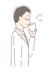 マグカップのコーヒーを飲む男性の横顔